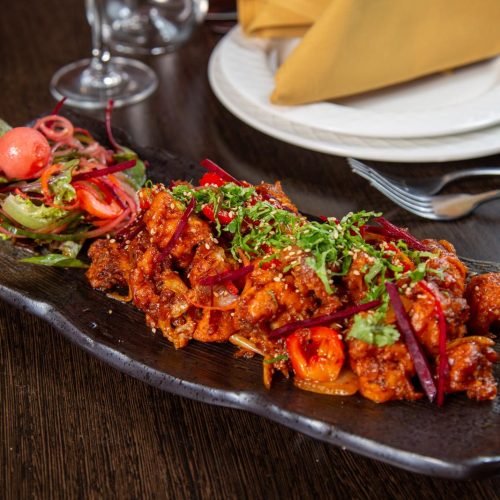 Spicy Chicken Chilli - A tantalizing dish served at our Australia Indian food restaurant, packed with bold flavors and aromatic spices.